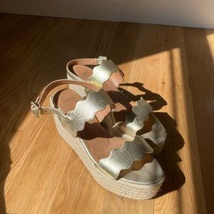 Castañer gold leather sandals.